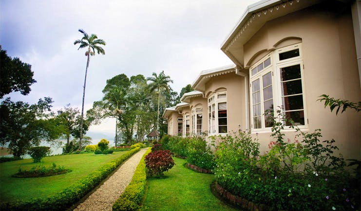 Ceylon Tea Trail Sri Lanka Castlereagh garden path through garden and bungalow front