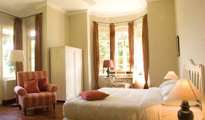 Ceylon Tea Trail Sri Lanka garden suite bedroom bay windows armchair