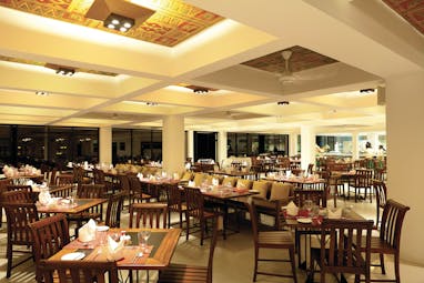 Cinnamon Citadel Sri Lanka restaurant indoor dining area tables chairs bright modern décor