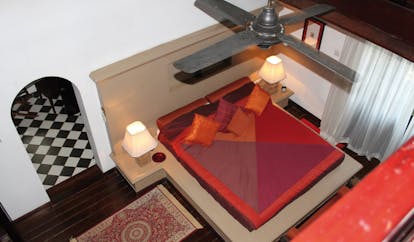Clingendael Sri Lanka red bedroom aerial view bed on plinth