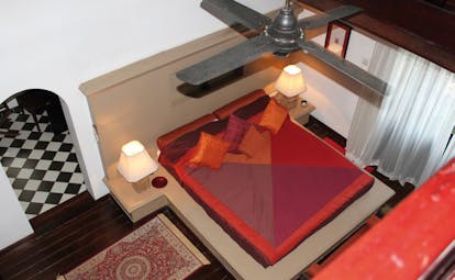 Clingendael Sri Lanka red bedroom aerial view bed on plinth