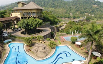 Earl's Regency Sri Lanka exterior hotel building pool tennis courts mountain in background