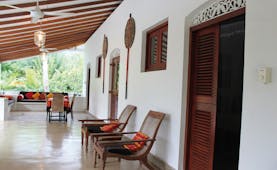 Ellerton Sri Lanka covered patio balcony trees loungers sofa