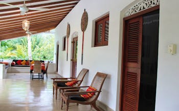 Ellerton Sri Lanka covered patio balcony trees loungers sofa