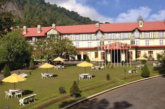 Grand Hotel Nuwara Eliya Sri Lanka exterior hotel building lawns hills in background