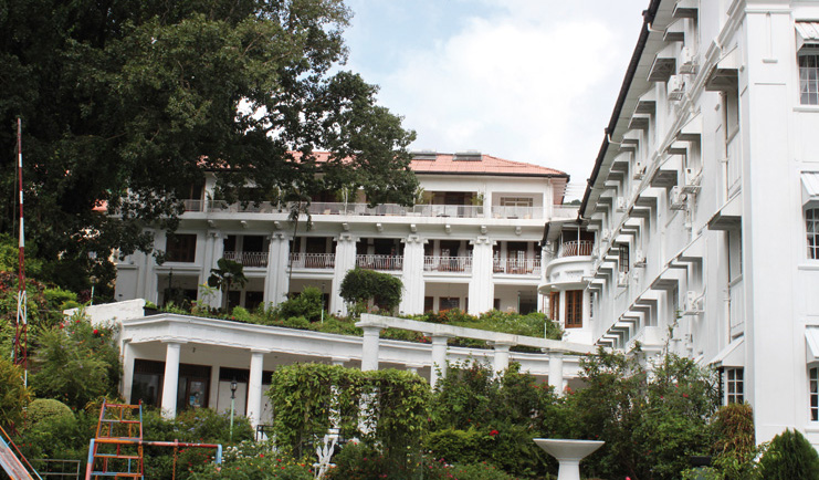 Hotel Suisse Sri Lanka exterior white hotel building balconies kids play area