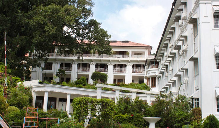 Hotel Suisse Sri Lanka exterior white hotel building balconies kids play area