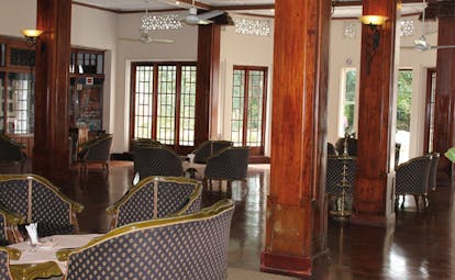 Hotel Suisse Sri Lanka lounge traditional decor wooden columns armchairs