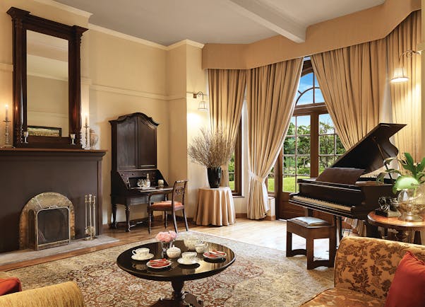 Jetwing Warwick Gardens living room, piano, antique furniture, elegant decor