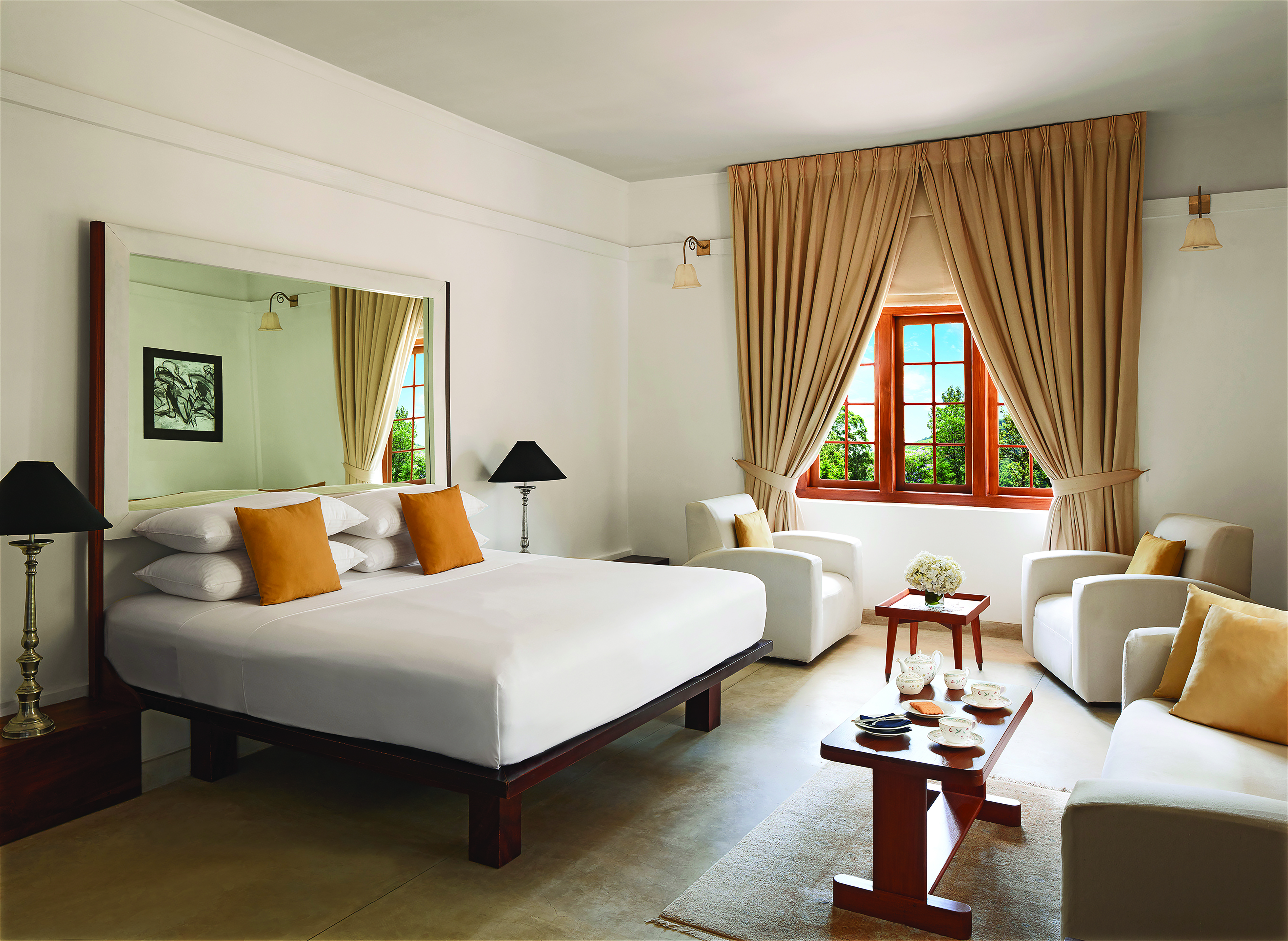 Jetwing Warwick Gardens white room, double bed, armchairs, elegant modern decor