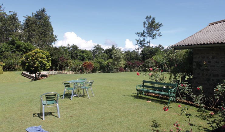 Kirchhayn Bungalow Sri Lanka garden lawns flowers benches and chairs 