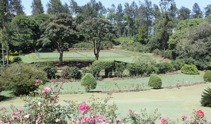 Kirchhayn Bungalow Sri Lanka tennis court from across lawned gardens