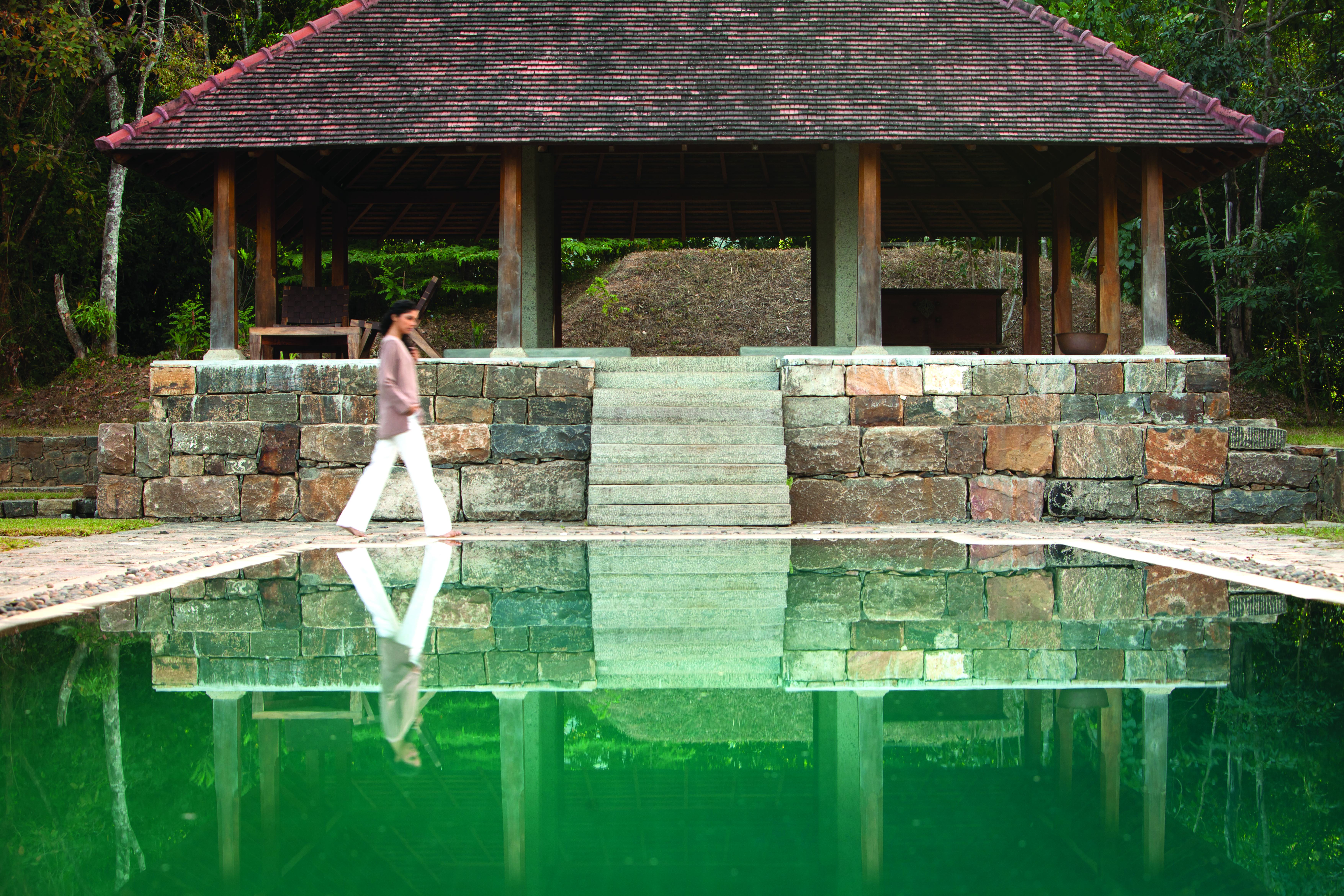 Living Heritage Sri Lanka pool covered veranda woman walking
