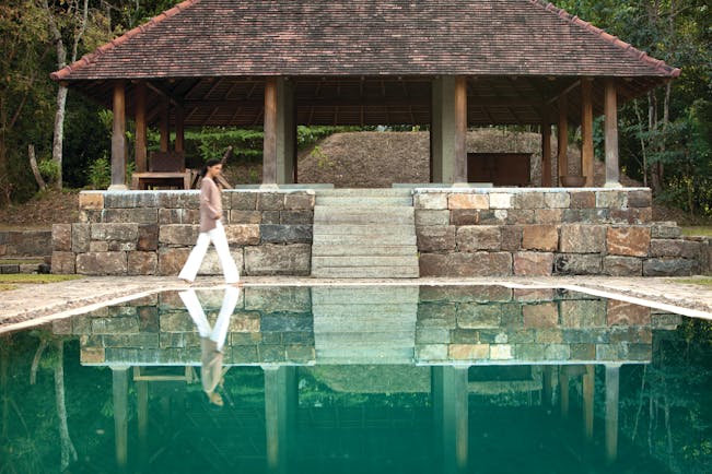 Living Heritage Sri Lanka pool covered veranda woman walking
