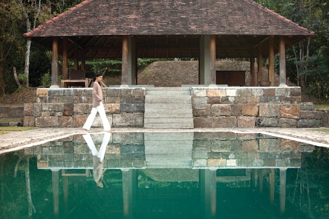 Living Heritage Sri Lanka pool covered veranda woman walking