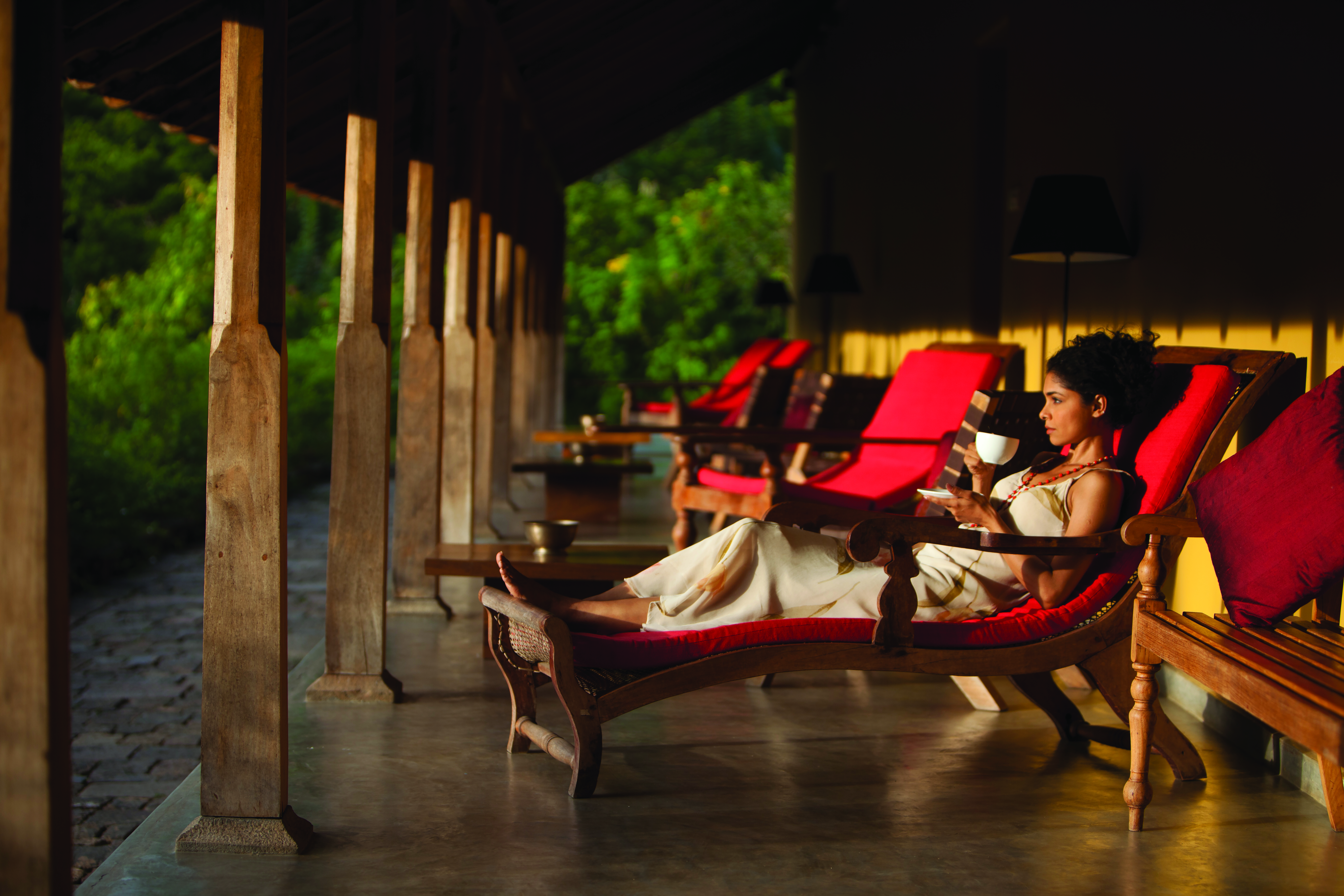 Living Heritage Sri Lanka veranda outdoor seating area woman drinking tea