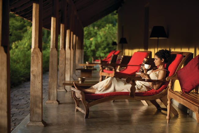 Living Heritage Sri Lanka veranda outdoor seating area woman drinking tea