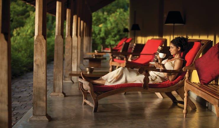 Living Heritage Sri Lanka veranda outdoor seating area woman drinking tea