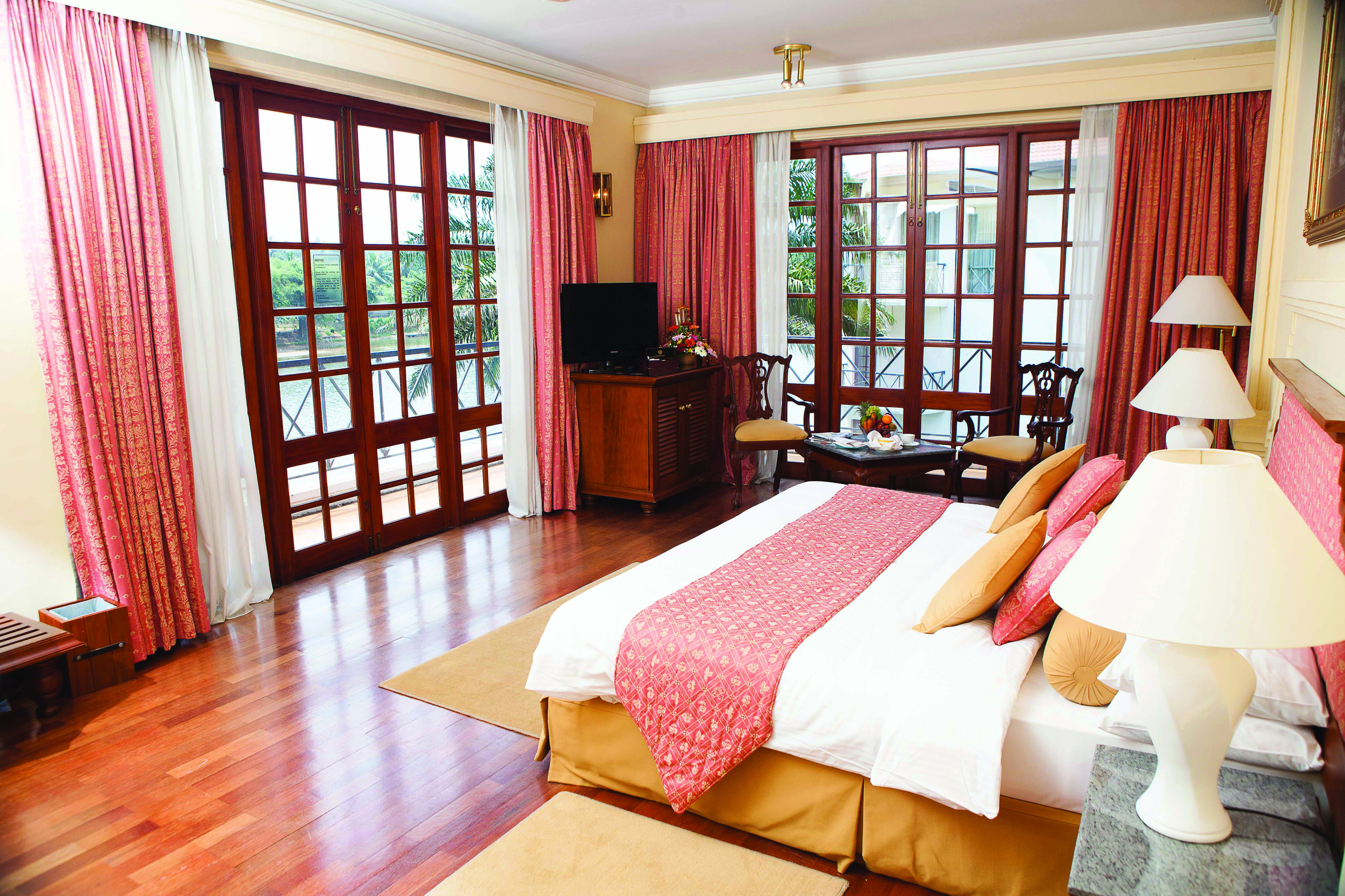 Mahaweli Reach Hotel deluxe room, double bed, modern decor