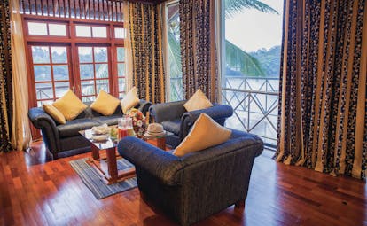 Mahaweli Reach Hotel executive suite, sofas, armchairs, view of river