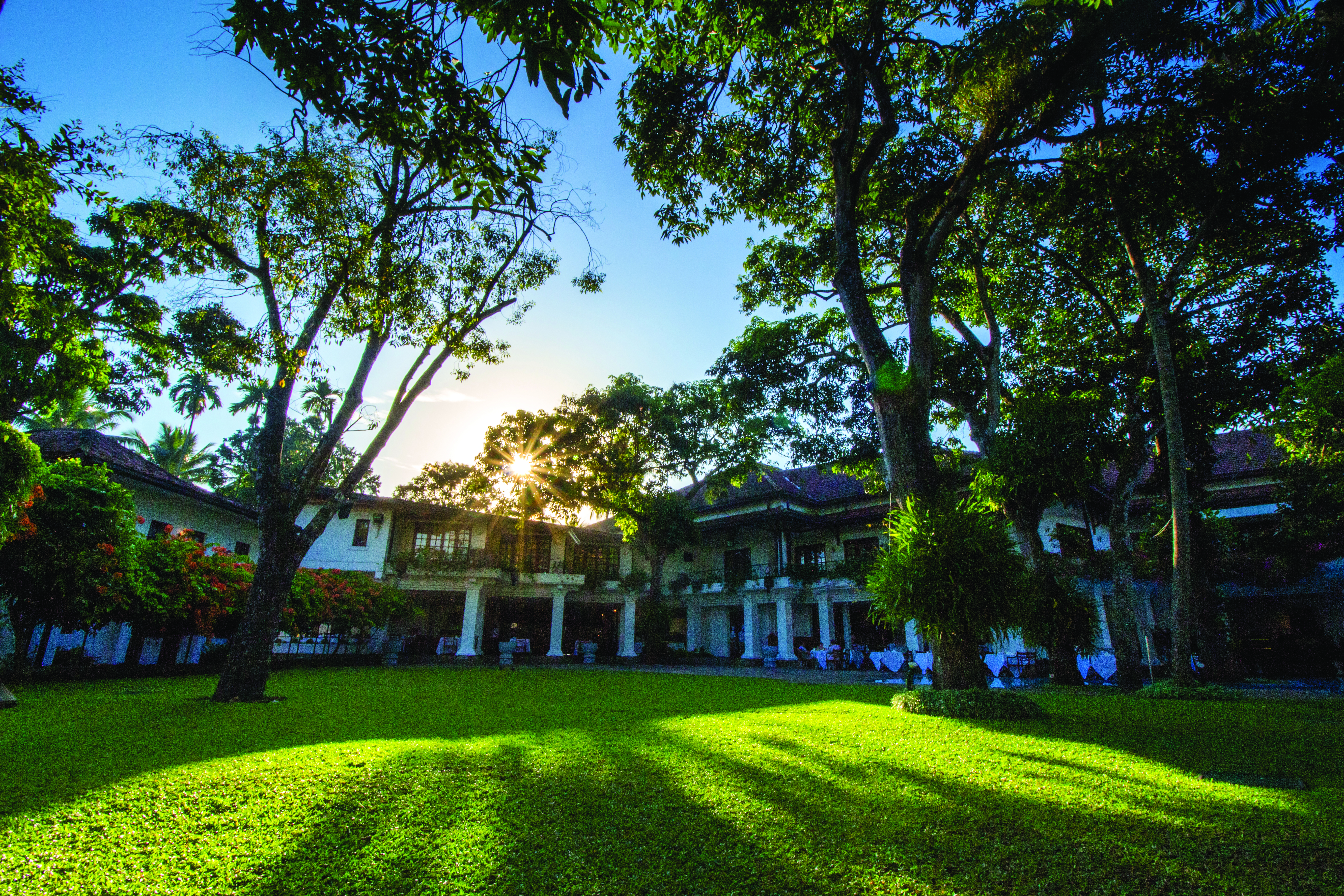 Mahaweli Reach Hotel gardens, trees, lawns, hotel buildings