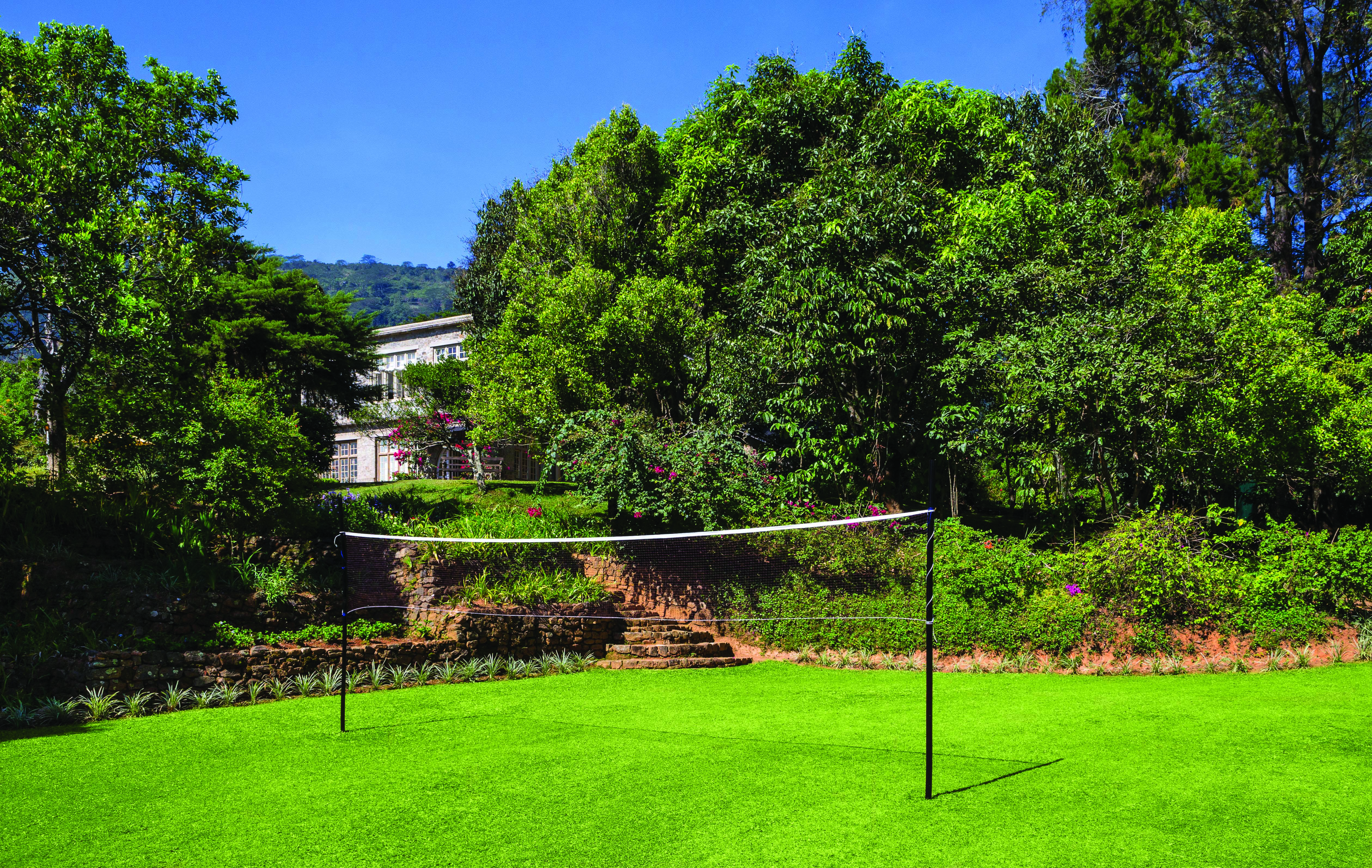 Taylor's Hill Sri Lanka gardens lawn trees shrubs badminton net