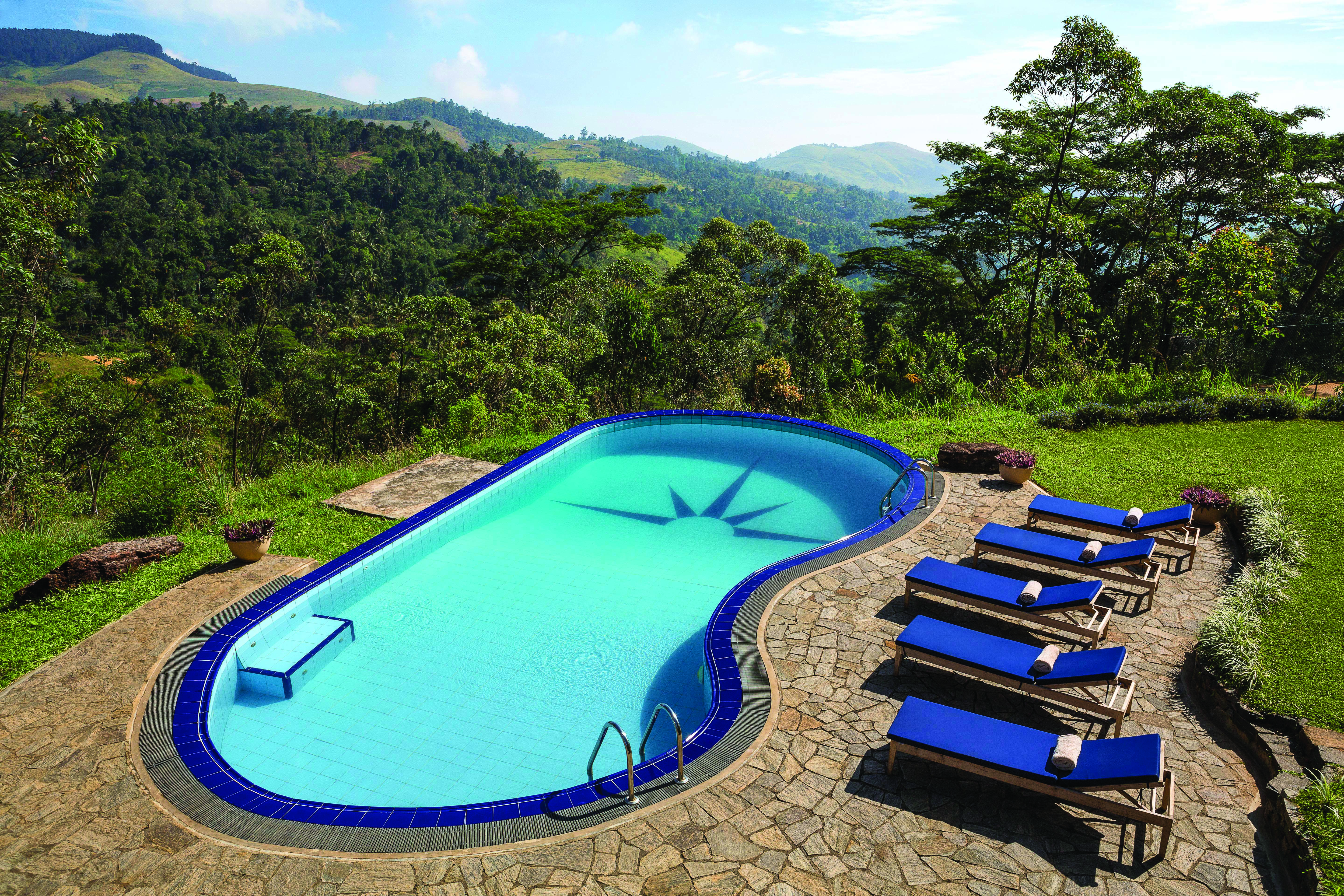 Taylor's Hill Sri Lanka pool terrace sun loungers countryside and mountains in background