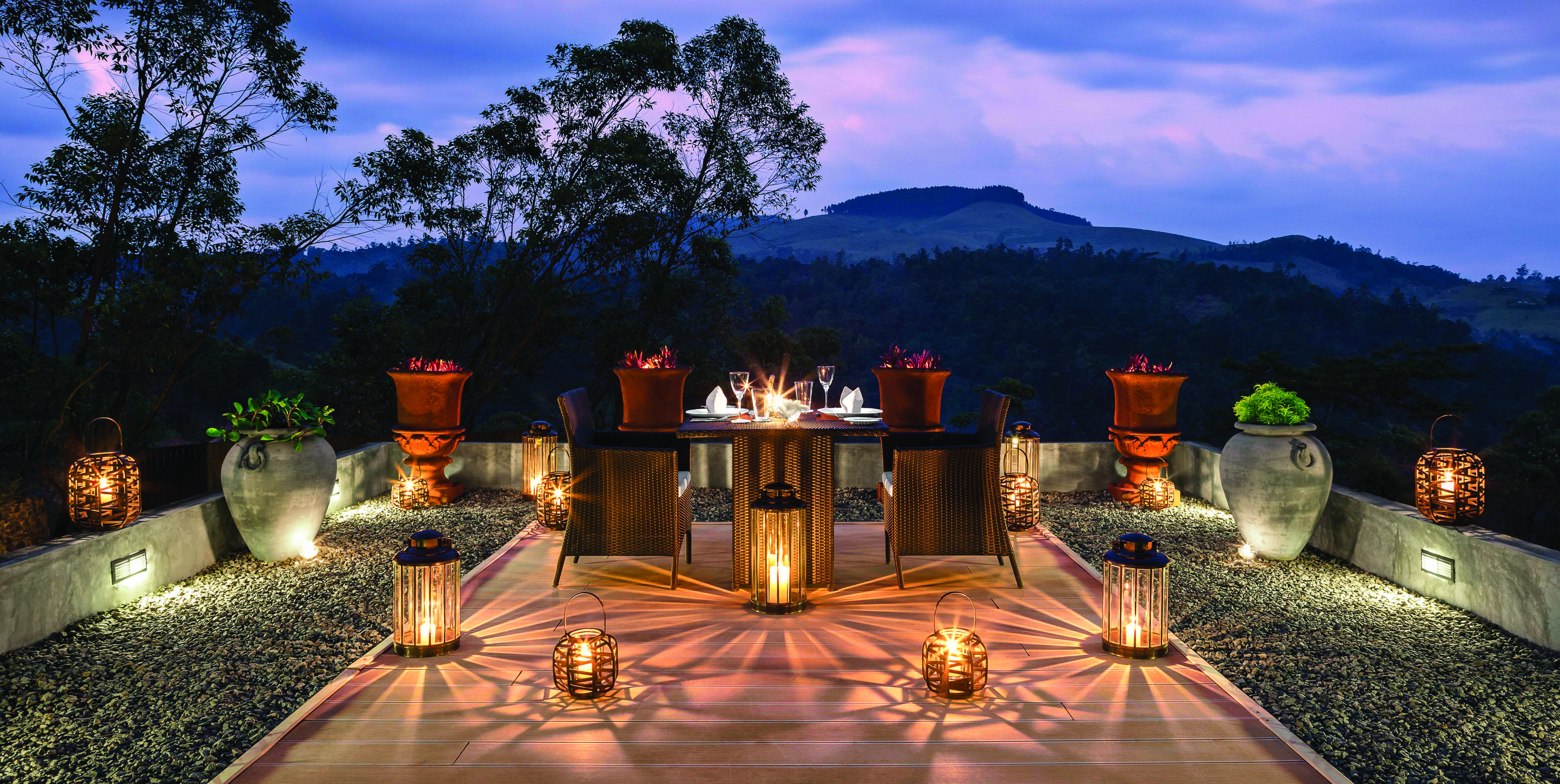 Taylor's Hill Sri Lanka terrace outdoor dining by night mountains in background