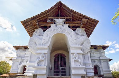 Lankatilaka Vihara temple white stone building, intricate carvings