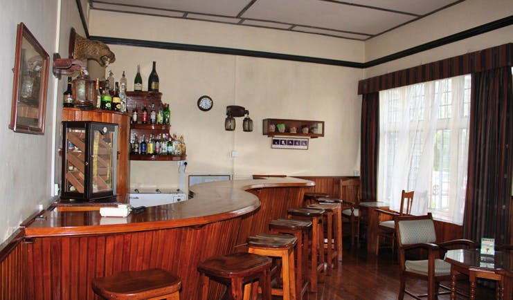 The Hill Club Sri Lanka bar area wood panelling traditional decor