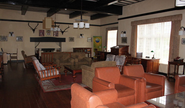 The Hill Club Sri Lanka with sofas and fireplace traditional decor 