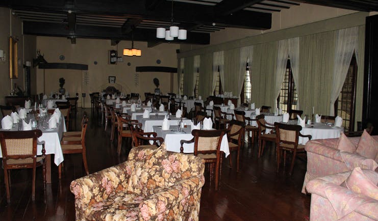 The Hill Club Sri Lanka main dining room restaurant traditional decor armchair