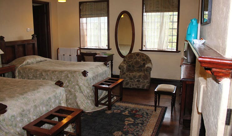 The Hill Club Sri Lanka twin bedroom fireplace armchair traditional decor