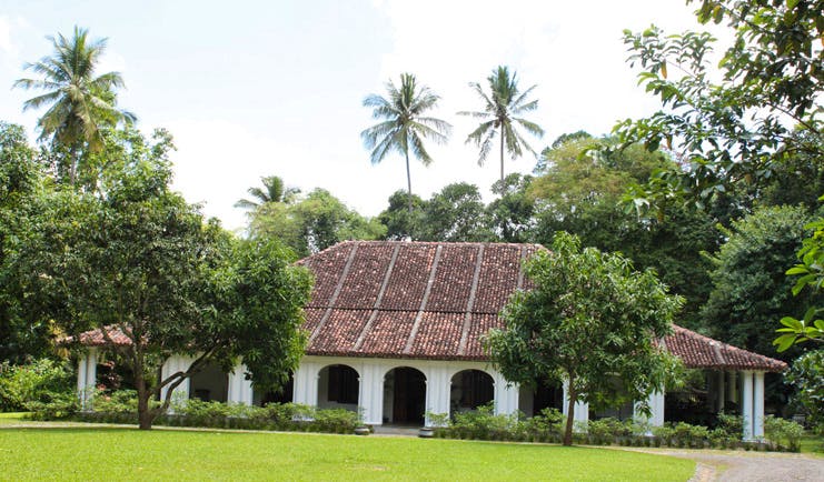 The Kandy House Sri Lanka exterior bungalow gardens and trees