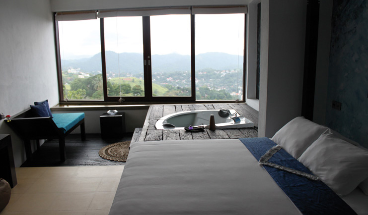 Theva Expressions Sri Lanka blue suite bed sofa jacuzzi forest view  