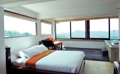 Theva Expressions Sri Lanka large bedroom minimalist decor wood sofa jacuzzi and panoramic views