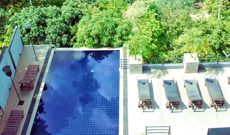 Theva Expressions Sri Lanka rooftop pool loungers forest view 