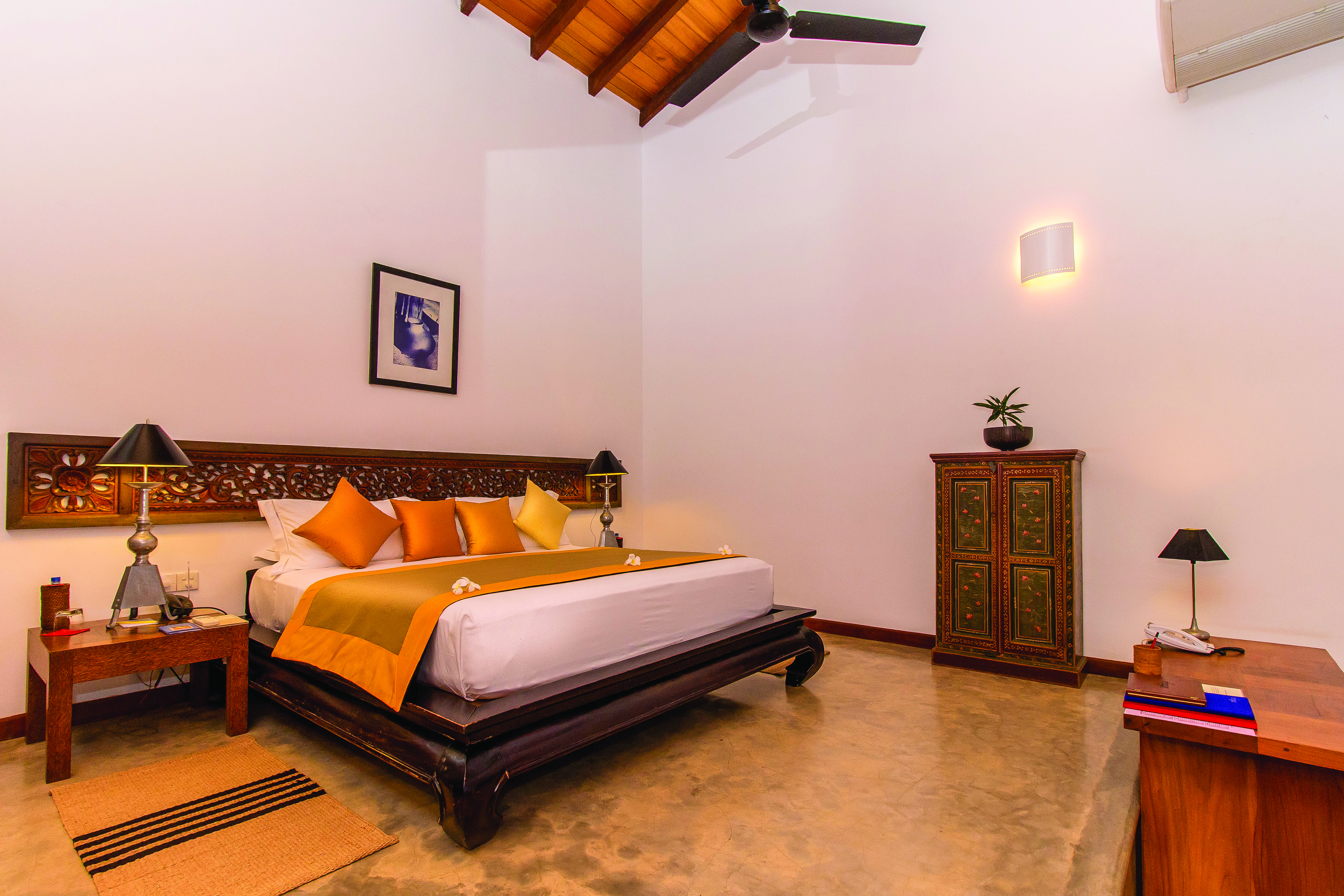 Aditya Resort sagara suite, double bed, antique sri lankan furniture, elegant decor