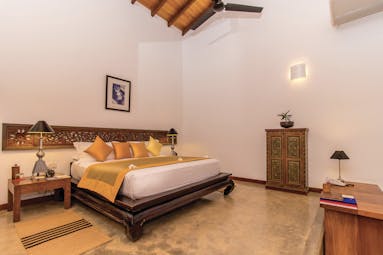 Aditya Resort sagara suite, double bed, antique sri lankan furniture, elegant decor