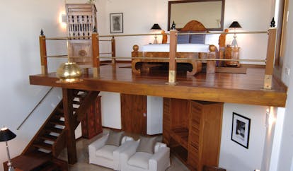 Aditya Resort surya mezzanine room with sofa downstairs and bedroom upstairs