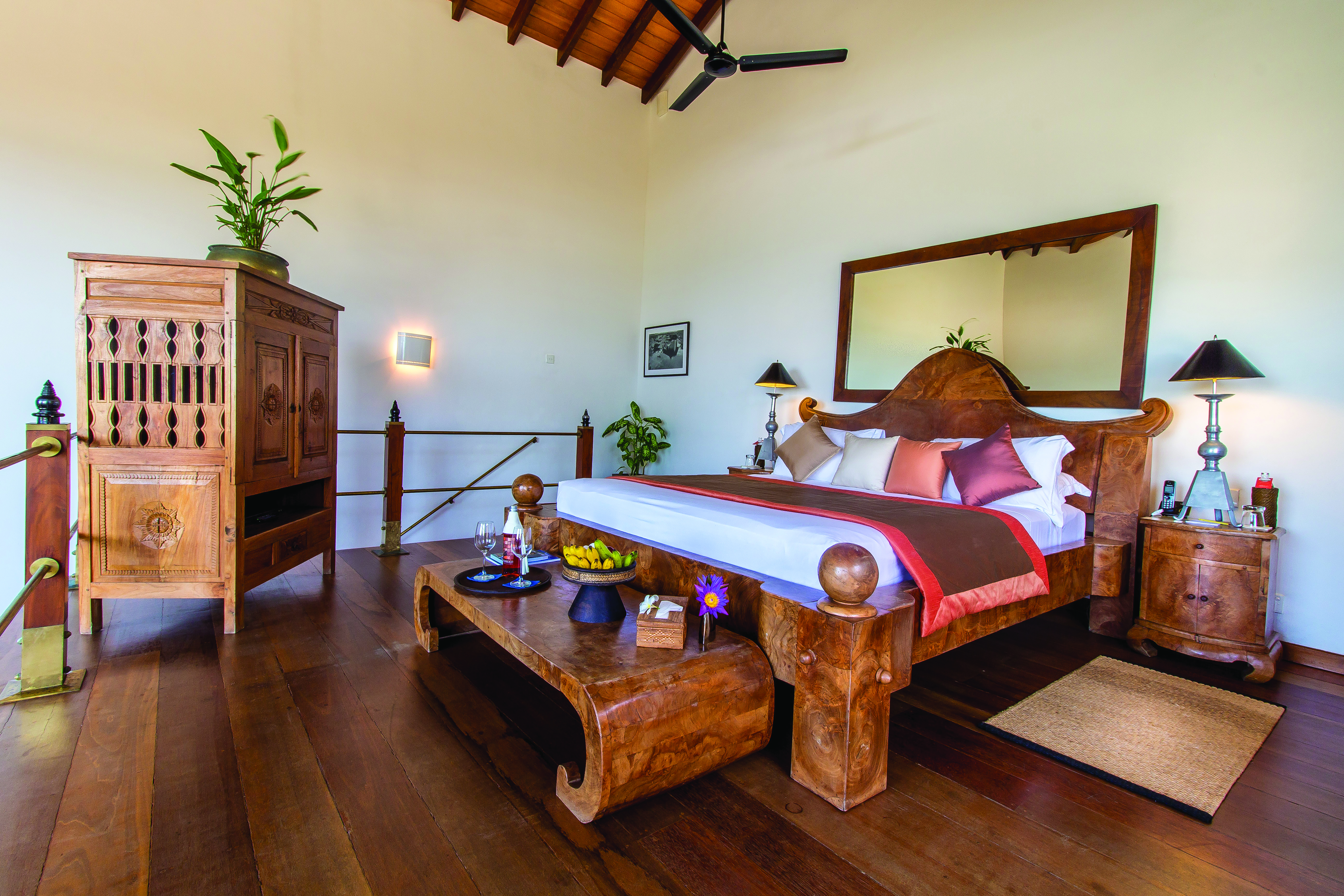 Aditya Resort surya suite, double bed with wooden frame, antique furniture, elegant decor