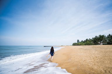 Anantara Kalutara Sri Lanka beach sand sea woman walking on the sand