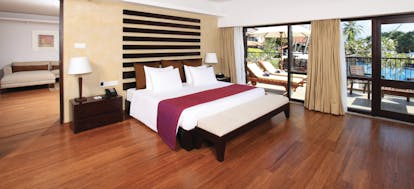 Avani Bentota Sri Lanka avani suite bed separate lounge area modern décor private terrace