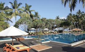 Avani Bentota Sri Lanka poolside sun loungers umbrellas beach in background