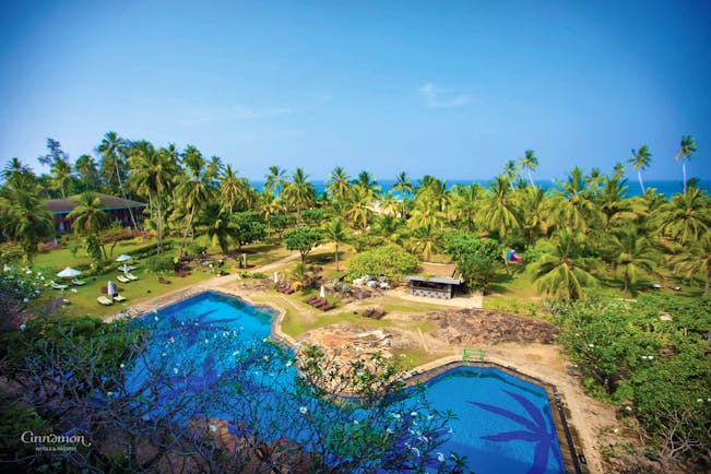 Bentota Beach Sri Lanka gardens pool lawns trees sea in background