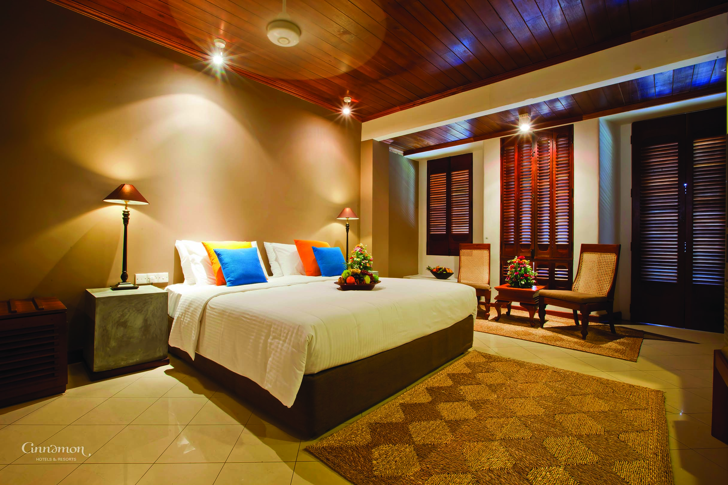 Bentota Beach Sri Lanka guestroom bed armchairs modern décor