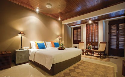 Bentota Beach Sri Lanka guestroom bed armchairs modern décor