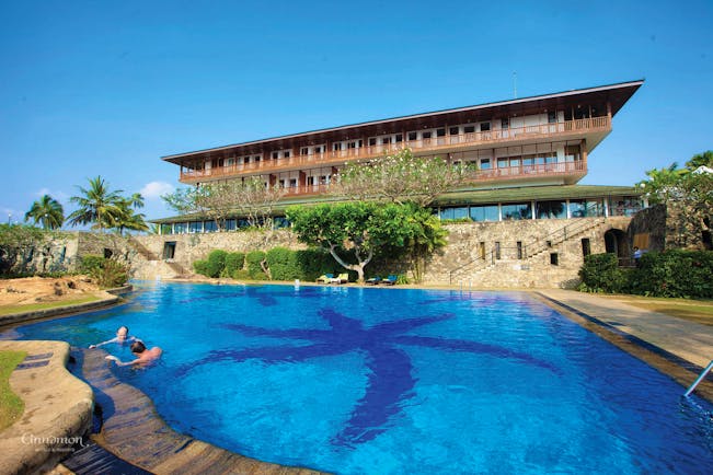 Bentota Beach Sri Lanka pool hotel building in background trees