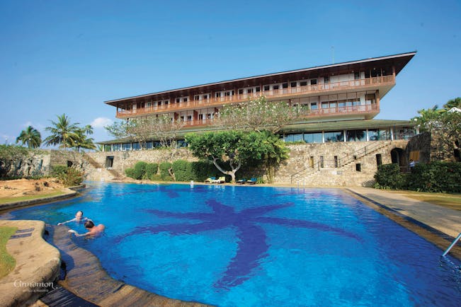 Bentota Beach Sri Lanka pool hotel building in background trees