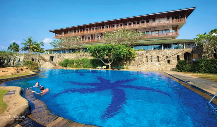 Bentota Beach Sri Lanka pool hotel building in background trees